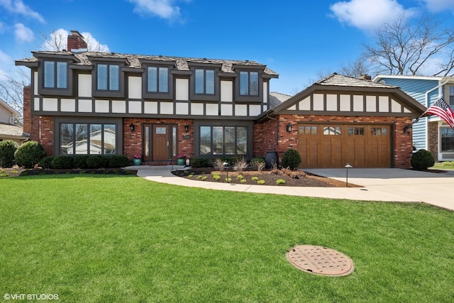 1181 Furlong Dr, Libertyville, IL 60048 - tudor-style house with brick siding, an attached garage, driveway, and a front yard
