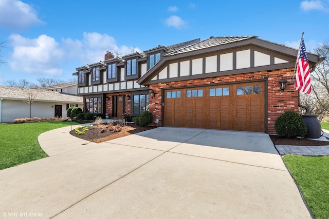 1181 Furlong Dr, Libertyville, IL 60048 - tudor home featuring brick siding, an attached garage, driveway, and a front yard