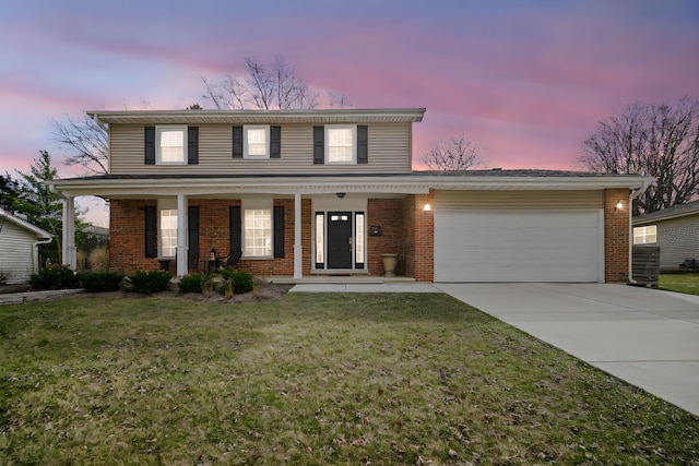 2005 Brentwood Ln, Wheaton, IL 60189 - traditional home featuring a lawn, driveway, a porch, a garage, and brick siding