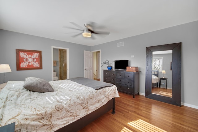 2005 Brentwood Ln, Wheaton, IL 60189 - bedroom featuring wood finished floors, ensuite bathroom, ceiling fan, baseboards, and visible vents