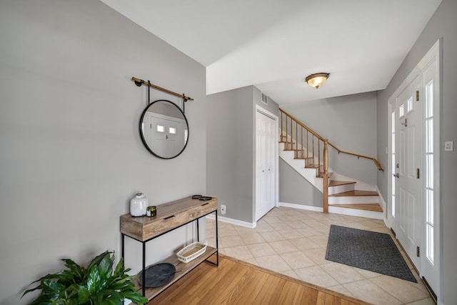 2005 Brentwood Ln, Wheaton, IL 60189 - entrance foyer with baseboards, stairs, and light tile patterned flooring