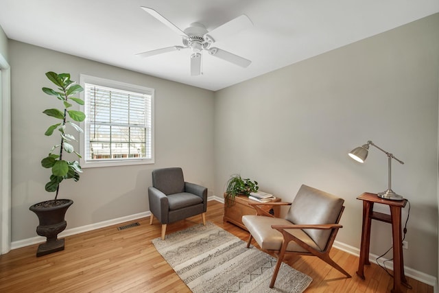 2005 Brentwood Ln, Wheaton, IL 60189 - living area with baseboards, visible vents, and light wood-style flooring