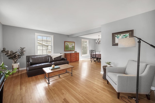 2005 Brentwood Ln, Wheaton, IL 60189 - living area featuring baseboards, a notable chandelier, and light wood-style floors