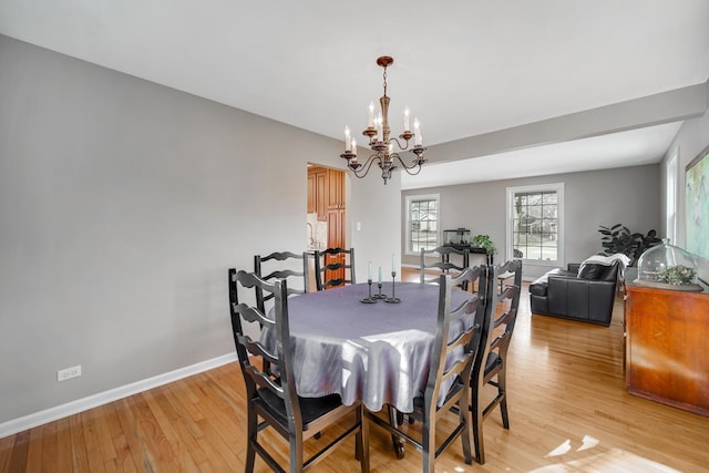2005 Brentwood Ln, Wheaton, IL 60189 - dining room featuring light wood finished floors, baseboards, and an inviting chandelier
