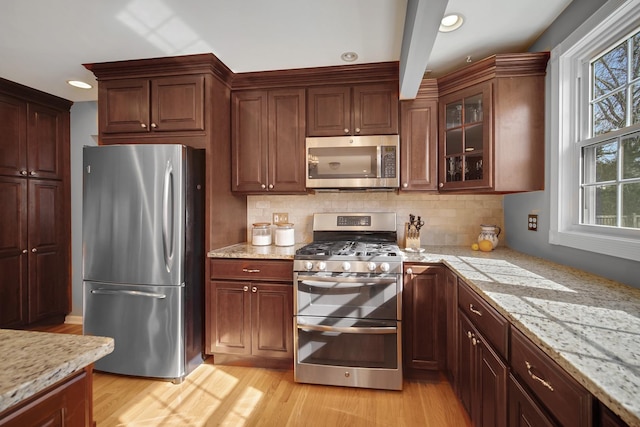 2005 Brentwood Ln, Wheaton, IL 60189 - kitchen with backsplash, light wood-type flooring, light stone counters, and stainless steel appliances