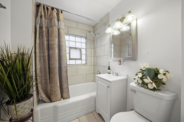 bathroom featuring tile patterned flooring, shower / bath combo with shower curtain, vanity, and toilet