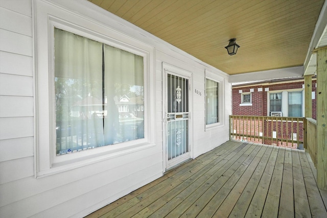 wooden terrace featuring covered porch