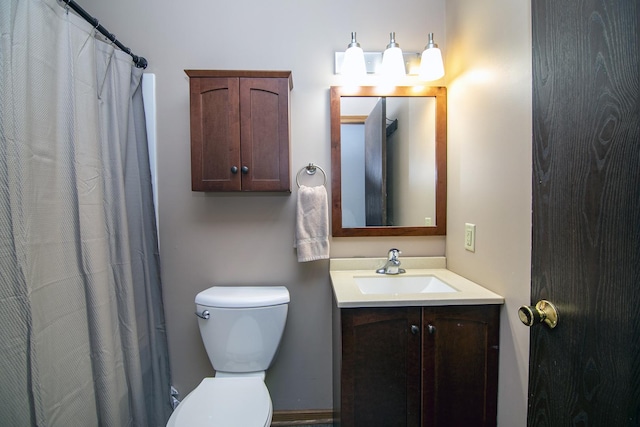 bathroom with toilet and vanity
