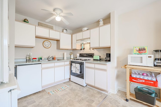 kitchen with under cabinet range hood, white appliances, light countertops, and a ceiling fan