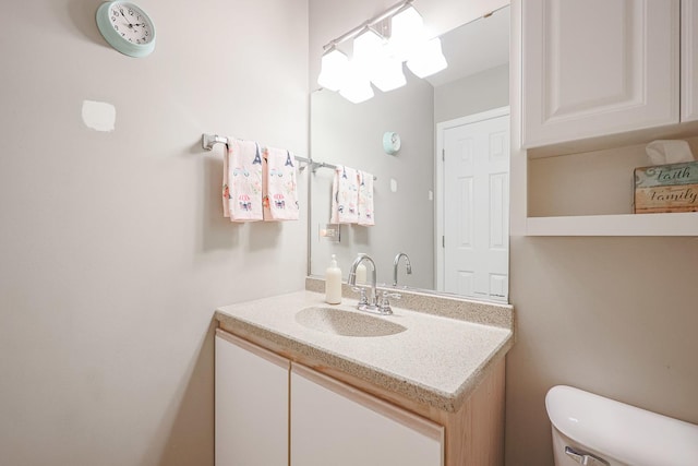 half bath with vanity and toilet