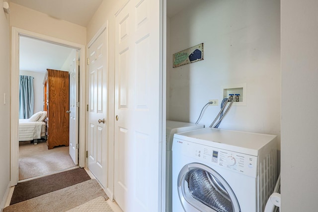 washroom featuring washer / clothes dryer and carpet