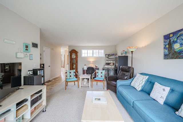 living area featuring light carpet