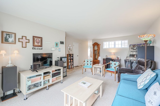 living area with light colored carpet
