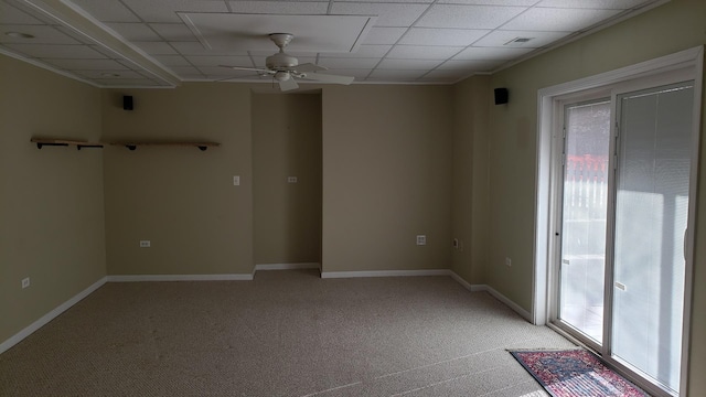 unfurnished room with light carpet, baseboards, a wealth of natural light, and ceiling fan