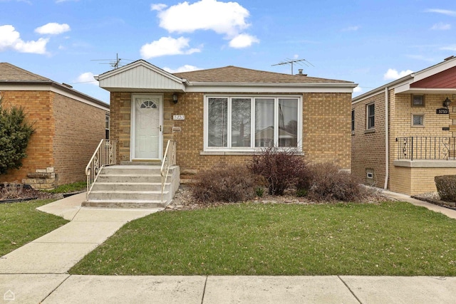 5753 S Moody Ave, Chicago, IL 60638 - bungalow featuring a front yard and brick siding