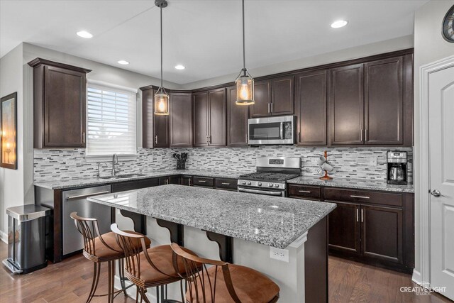6625 Savanna Ln, Lakewood, IL 60014 - kitchen featuring dark brown cabinetry, appliances with stainless steel finishes, dark wood-type flooring, and a sink