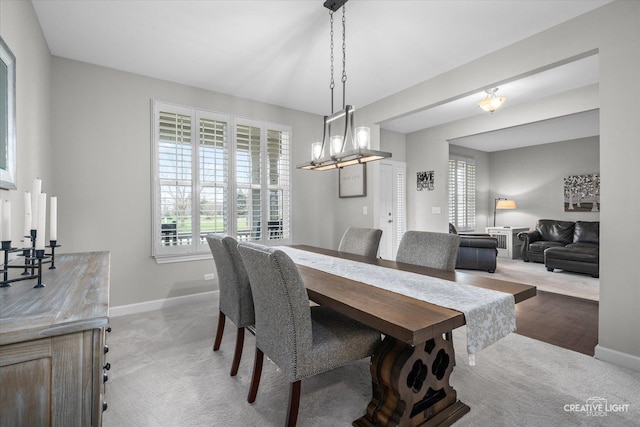 6625 Savanna Ln, Lakewood, IL 60014 - dining area with baseboards, a notable chandelier, and light carpet