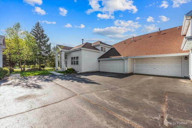 9531 Lenox Ln, Lakewood, IL 60014 - view of property exterior with concrete driveway and a garage