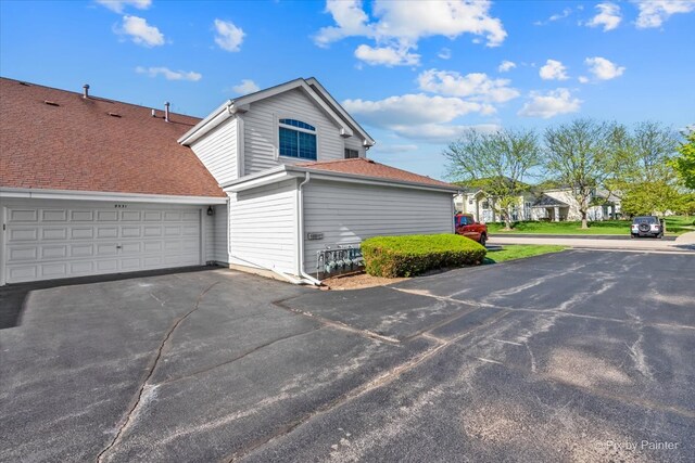 9531 Lenox Ln, Lakewood, IL 60014 - view of home's exterior featuring driveway and a garage
