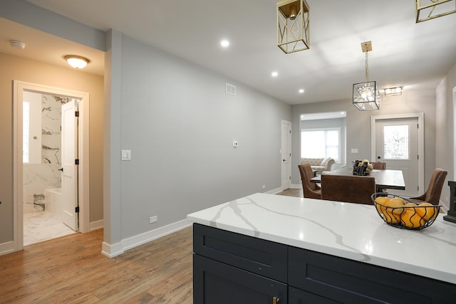 9046 S Racine Ave, Chicago, IL 60620 - kitchen featuring recessed lighting, baseboards, light stone counters, and light wood-style floors