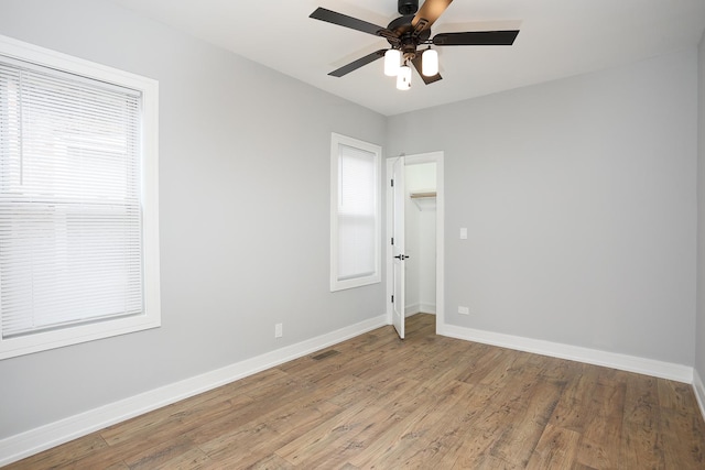 9046 S Racine Ave, Chicago, IL 60620 - empty room featuring ceiling fan, light wood finished floors, baseboards, and visible vents