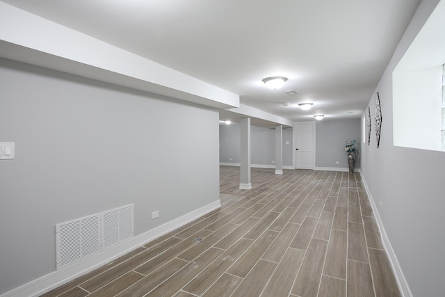 9046 S Racine Ave, Chicago, IL 60620 - finished basement featuring visible vents, baseboards, and wood finished floors