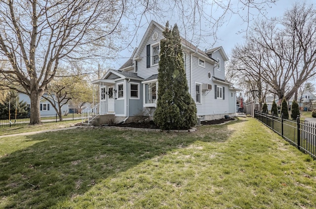 view of side of property featuring a lawn and fence private yard