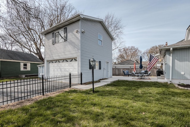 view of property exterior featuring concrete driveway, fence, a garage, a patio area, and a yard