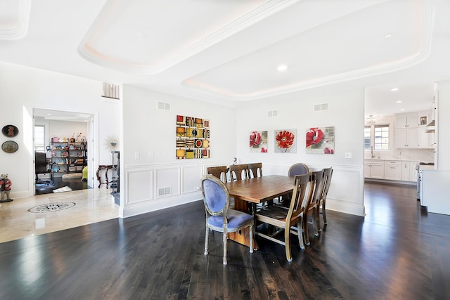 22328 N Prairie Ct, Kildeer, IL 60047 - dining space featuring a raised ceiling, dark wood-style floors, recessed lighting, and crown molding