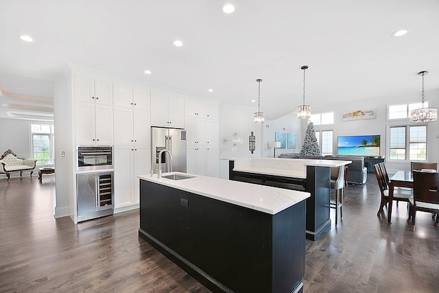 22328 N Prairie Ct, Kildeer, IL 60047 - kitchen featuring a center island with sink, wine cooler, high end refrigerator, a sink, and recessed lighting