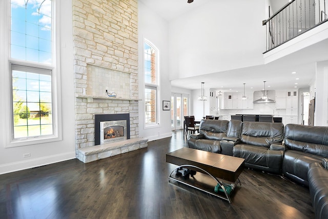 22328 N Prairie Ct, Kildeer, IL 60047 - living room featuring a high ceiling, baseboards, dark wood finished floors, and a fireplace