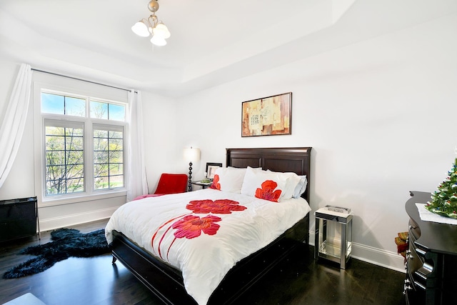 22328 N Prairie Ct, Kildeer, IL 60047 - bedroom featuring baseboards, wood finished floors, and a tray ceiling