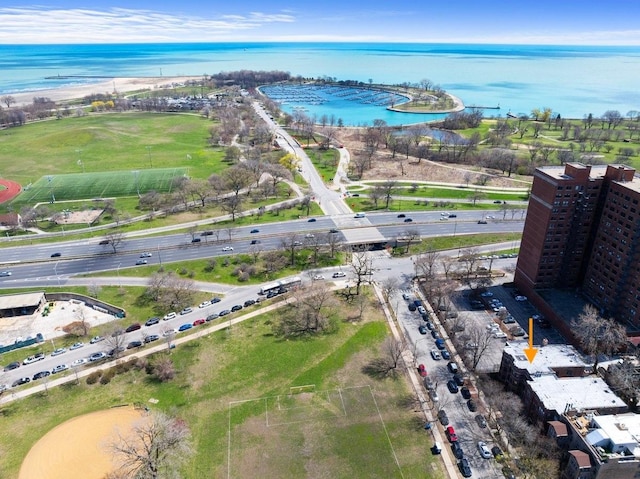 birds eye view of property featuring a water view