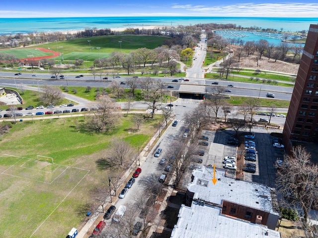 birds eye view of property with a water view