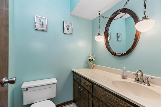 bathroom featuring toilet and vanity