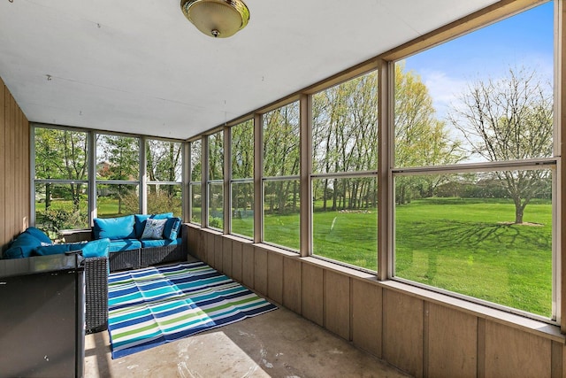 sunroom featuring plenty of natural light and outdoor lounge area