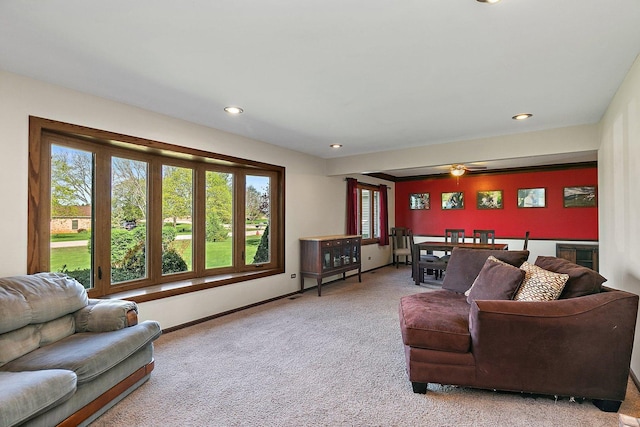 living room featuring carpet floors, ceiling fan, baseboards, and recessed lighting