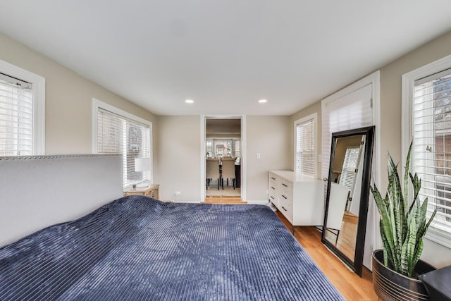 unfurnished bedroom featuring light wood-style flooring and recessed lighting