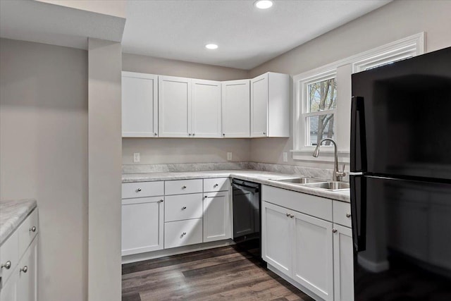 1980 W Forest Ave, Decatur, IL 62522 - kitchen with a sink, light countertops, recessed lighting, black appliances, and white cabinetry
