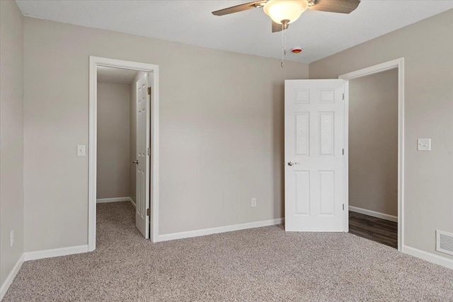 1980 W Forest Ave, Decatur, IL 62522 - unfurnished bedroom with ceiling fan, baseboards, visible vents, and carpet floors