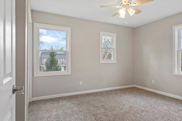 1980 W Forest Ave, Decatur, IL 62522 - carpeted empty room with baseboards and a ceiling fan