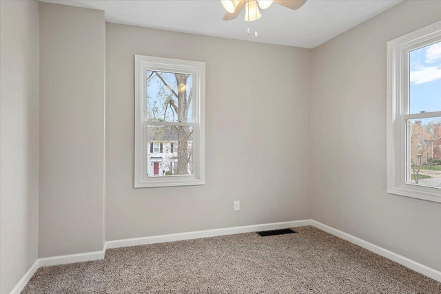 1980 W Forest Ave, Decatur, IL 62522 - carpeted spare room featuring ceiling fan, baseboards, and plenty of natural light