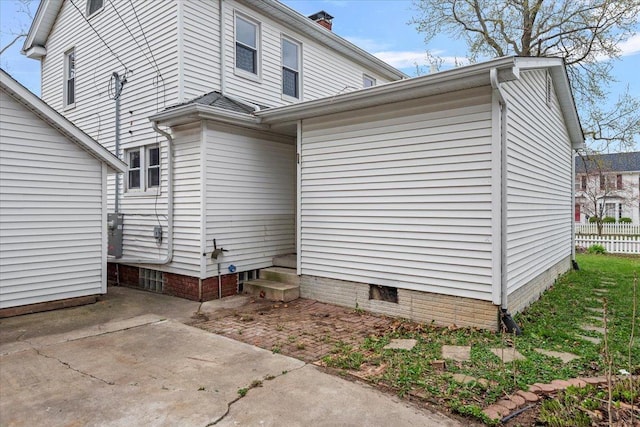 1980 W Forest Ave, Decatur, IL 62522 - view of property exterior featuring a patio, a chimney, and fence
