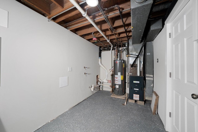 unfinished below grade area featuring heating unit and gas water heater