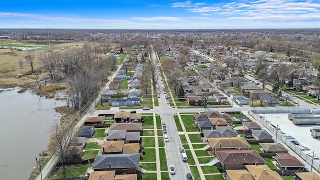 bird's eye view with a residential view and a water view