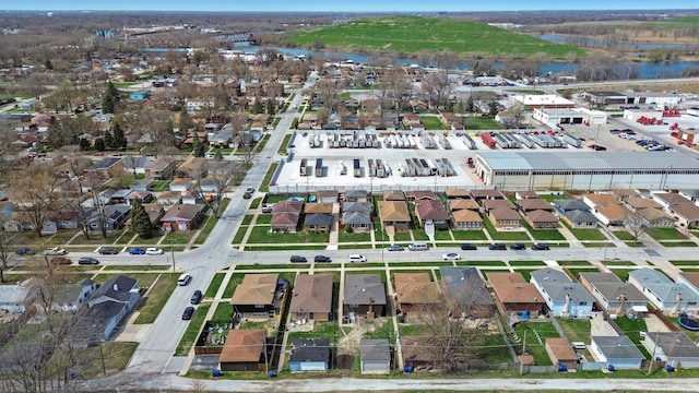 drone / aerial view featuring a water view and a residential view