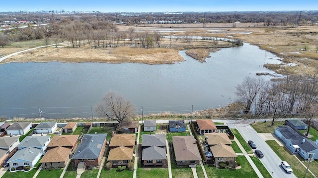 birds eye view of property featuring a residential view and a water view
