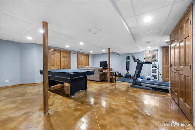 playroom with baseboards, recessed lighting, a drop ceiling, and finished concrete floors