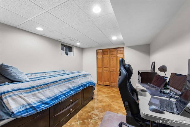 bedroom with light tile patterned flooring and recessed lighting
