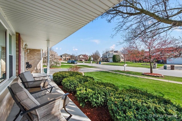 view of patio / terrace featuring covered porch and a residential view